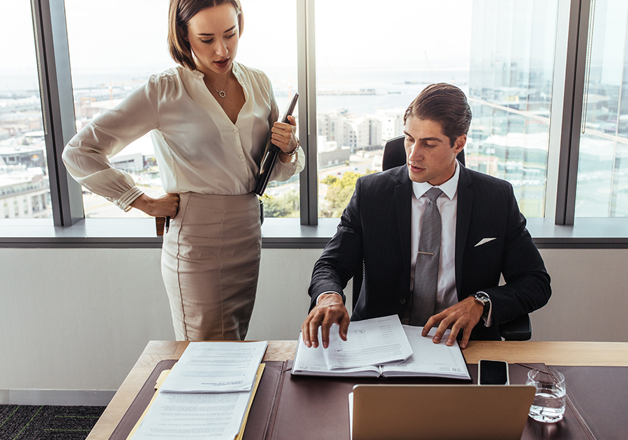 two attorneys discussing papers